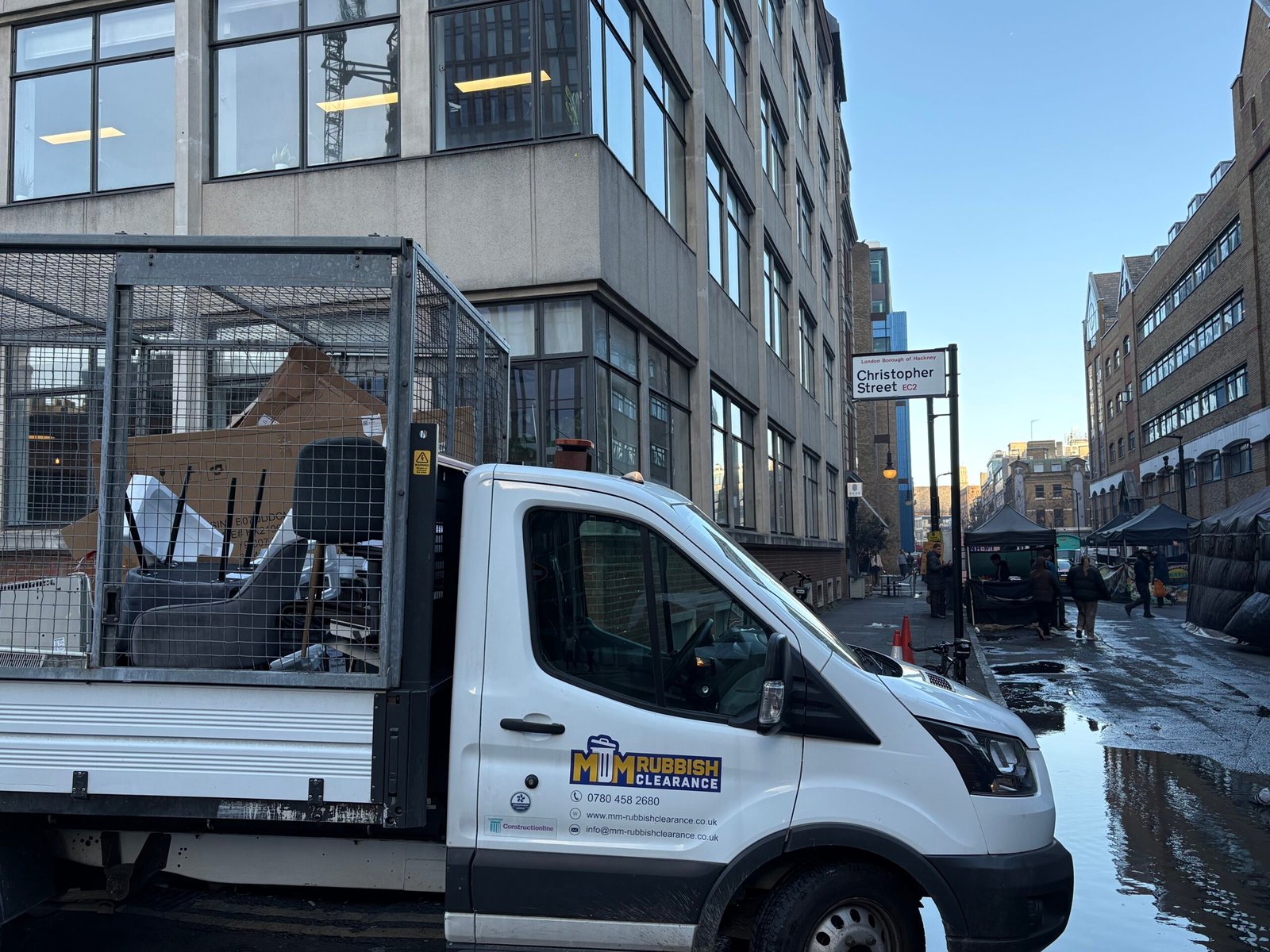 MM Rubbish Clearance van on the street in EC2 City of London providing licensed rubbish clearance
