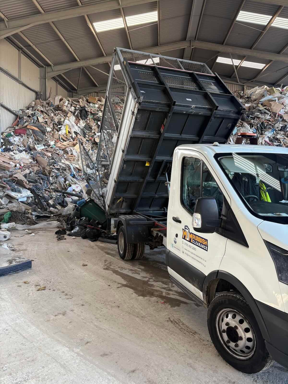 MM Rubbish Clearance van tipping waste at a licensed recycling plant in London