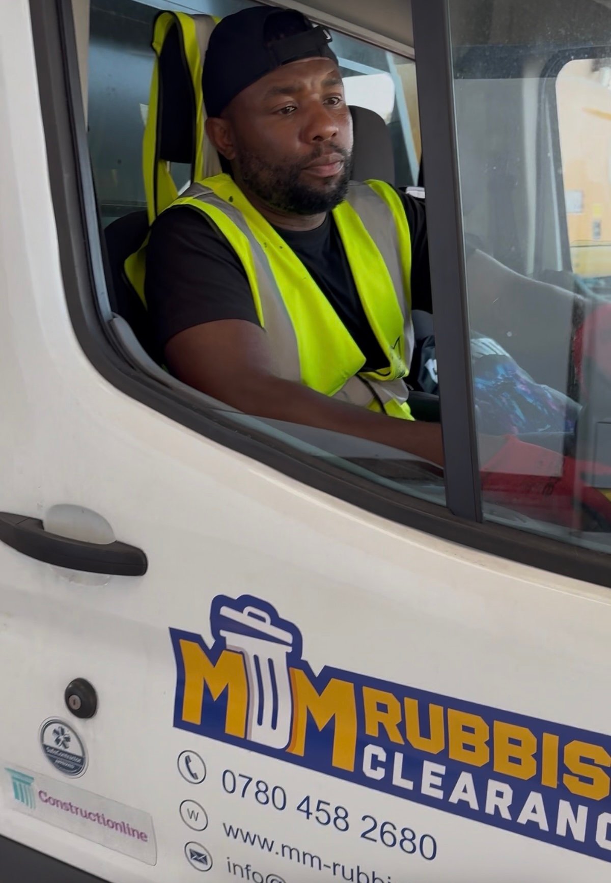 Ovi from MM Rubbish Clearance standing beside the branded van in Islington N1