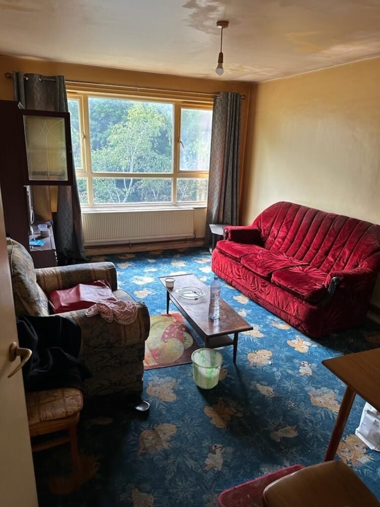Furnished living room awaiting a probate house clearance in London