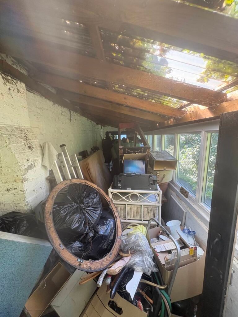 Garage in Canonbury, Islington N1 filled with mixed waste before clearance