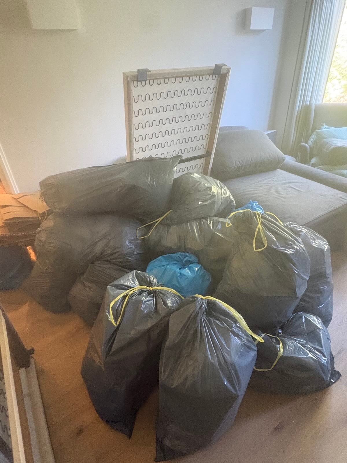 Pile of bagged household waste in a flat on Sloane Street, Chelsea, before a partial flat clearance
