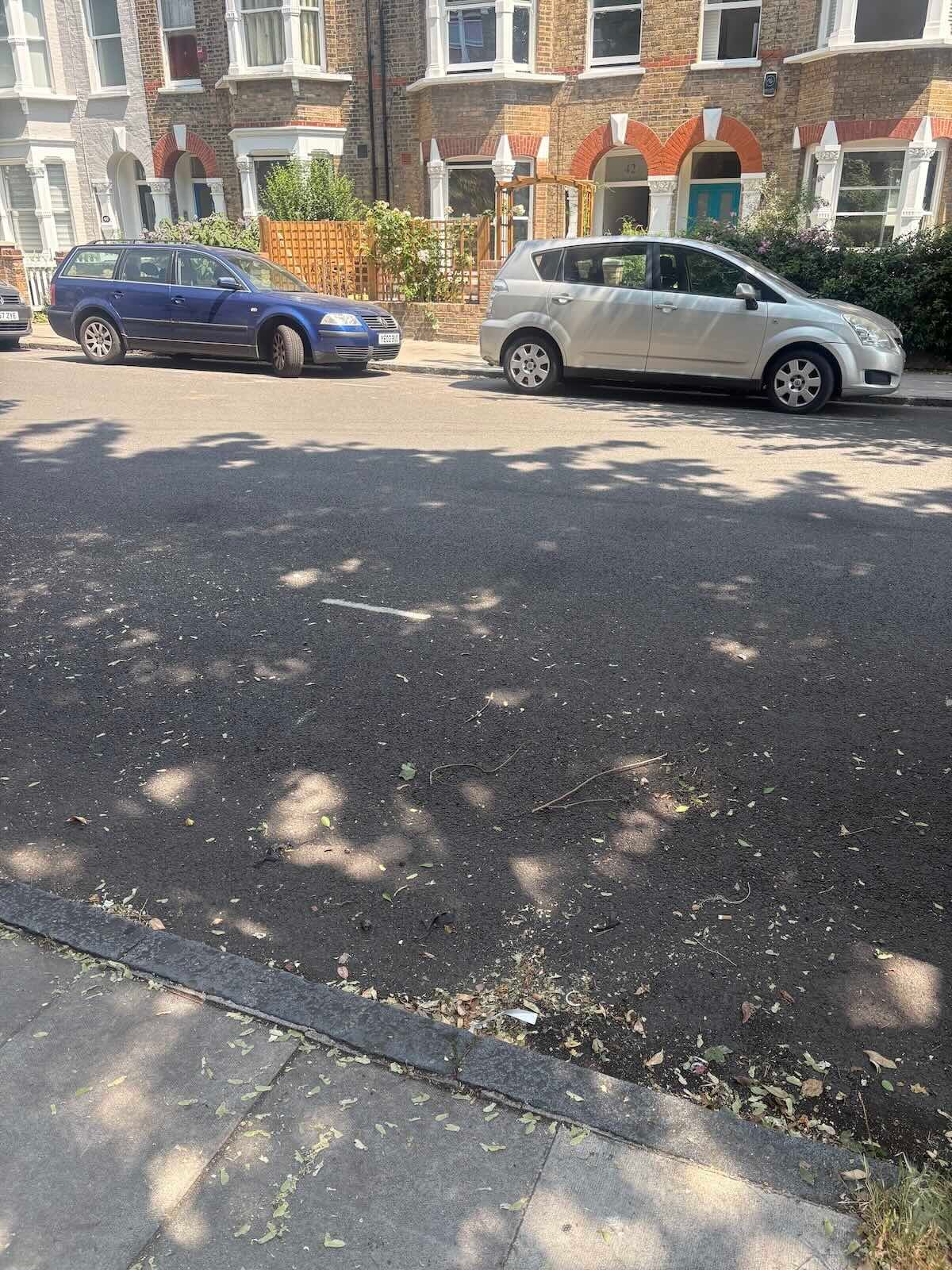 The same Archway N19 kerbside space clear after the garden waste bags were collected