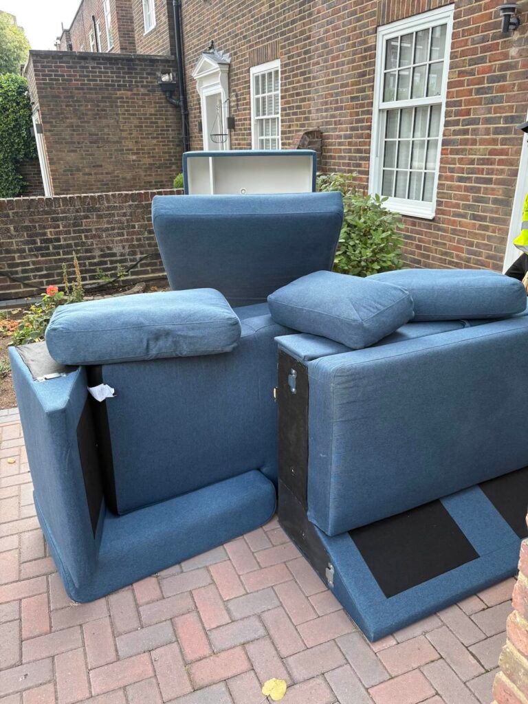 Dismantled blue sofa ready for removal in South Hampstead NW6