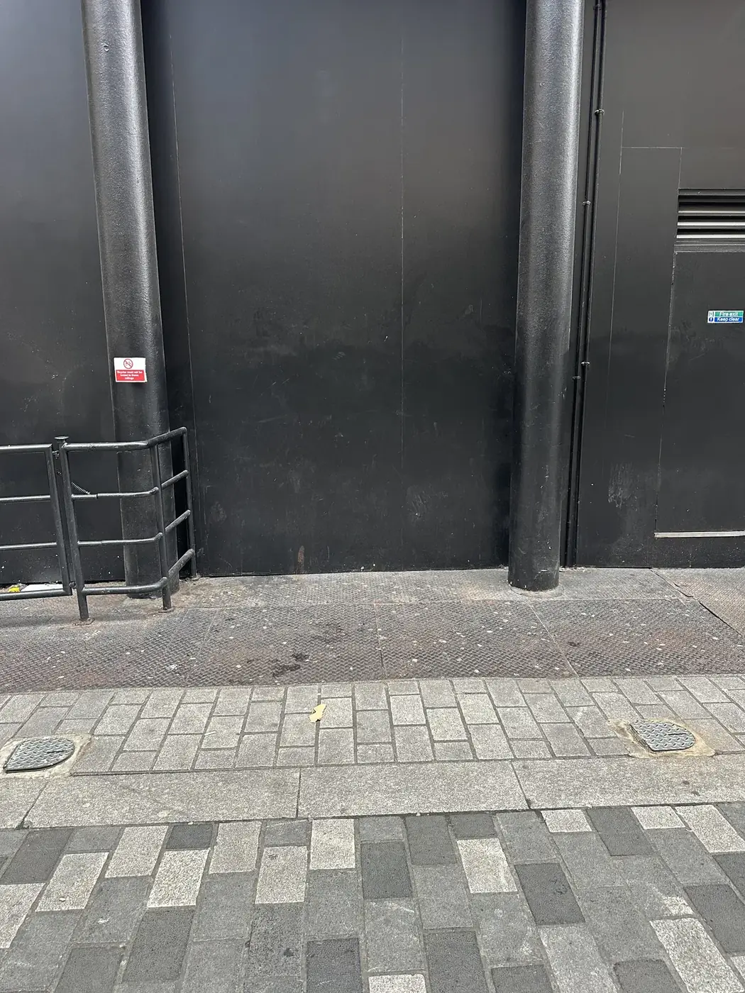 Cleared pavement and frontage after rubbish collection in Soho W1.